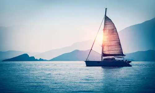 Sailboat at sunset - sailing into retirement